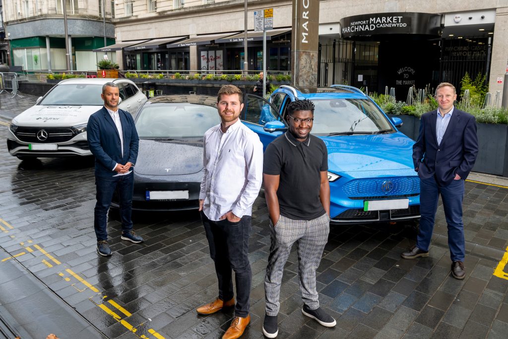 Voltric founders with electric vehicles