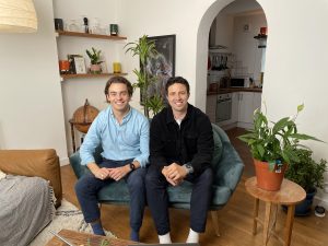 spacebands founders smiling sitting on sofa in living room