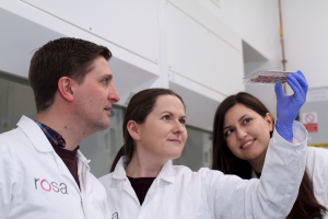 Three Rosa Biotech scientists in lab looking at samples