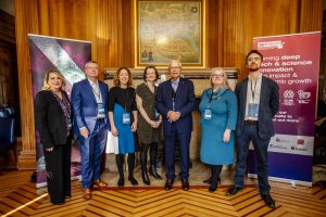 A group of government, university and industry leaders at the Economic Summit event