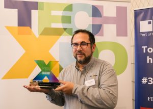 Gianluca, Metasonixx CEO with Best Elevator Pitch award at Tech-Xpo 2024.