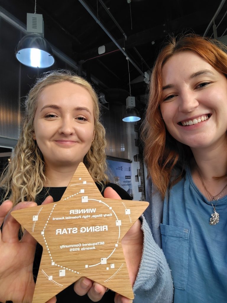 Amy Cox (L) and Laura Gemmell (R) from Taught by Humans team with award.
